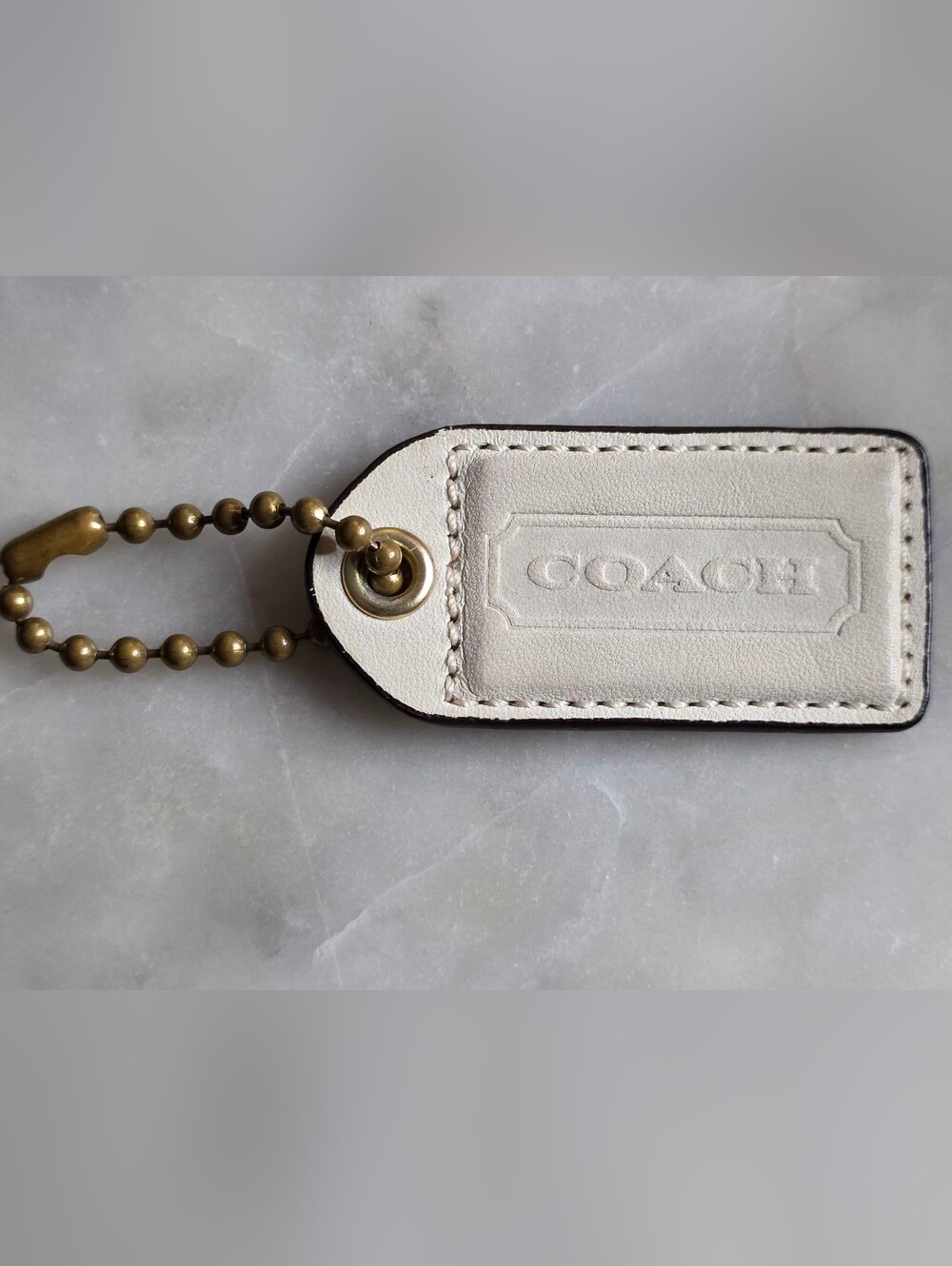 COACH White Leather Tag with Brass Ball Chain